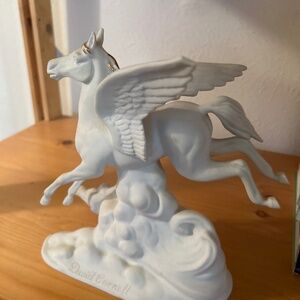 Statue with gold accents